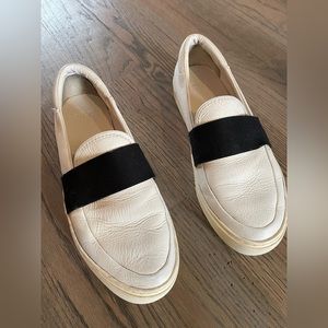 Ugh white slip on shoes with black accent